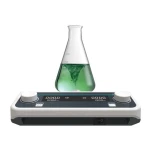 Conical flask with green liquid being stirred